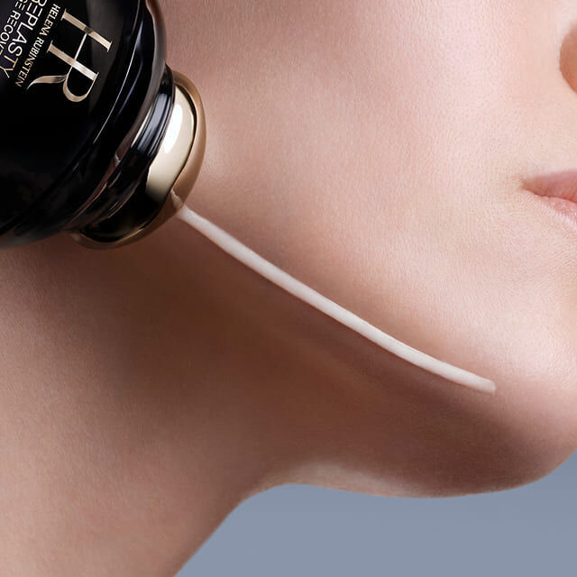 Helena Rubinstein Replasty Age Recovery Eye & Face Contour Concentrate applicator dispensing cream onto a woman's cheek.