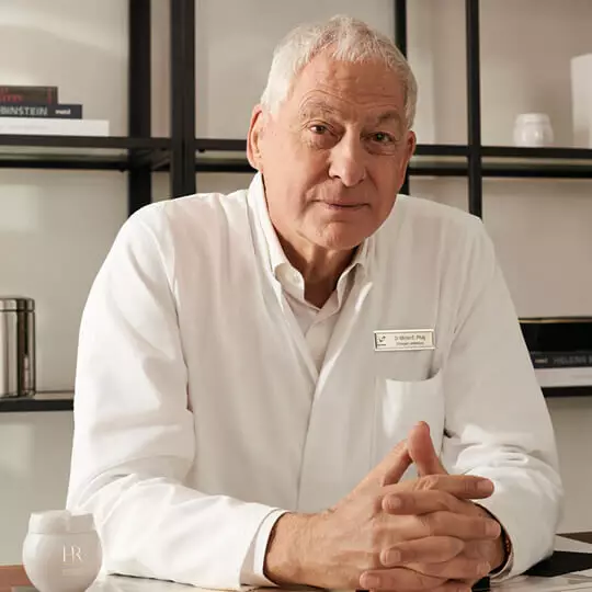 Dr. Michel E. Pfulg, associated with Helena Rubinstein REPLASTY, in a professional setting.