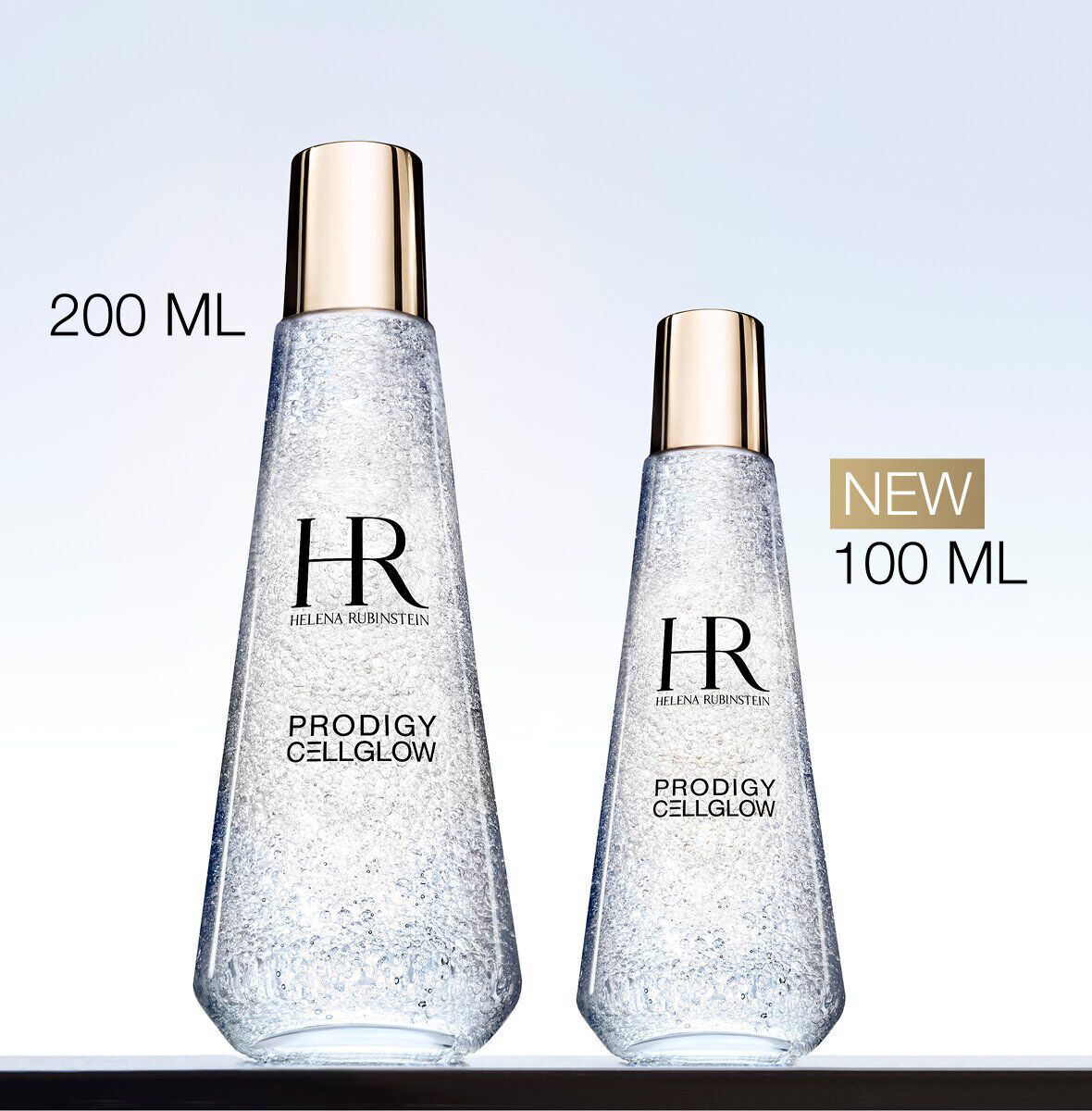 Two Helena Rubinstein Prodigy Cellglow Dewy Essence bottles in 200 ml and new 100 ml sizes.