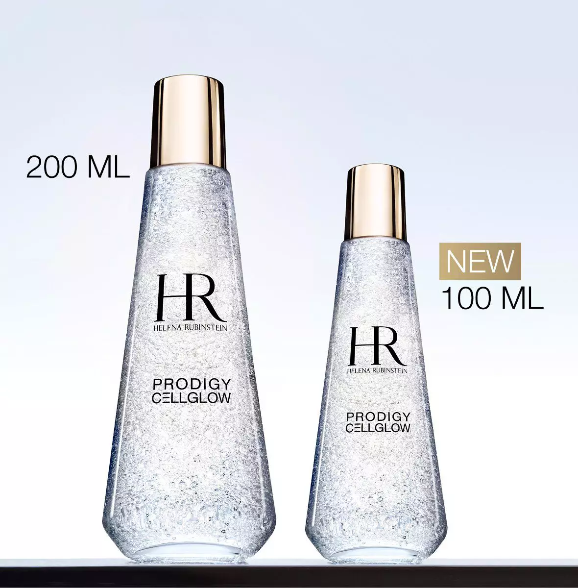 Two Helena Rubinstein Prodigy Cellglow Dewy Essence bottles in 200 ml and new 100 ml sizes.