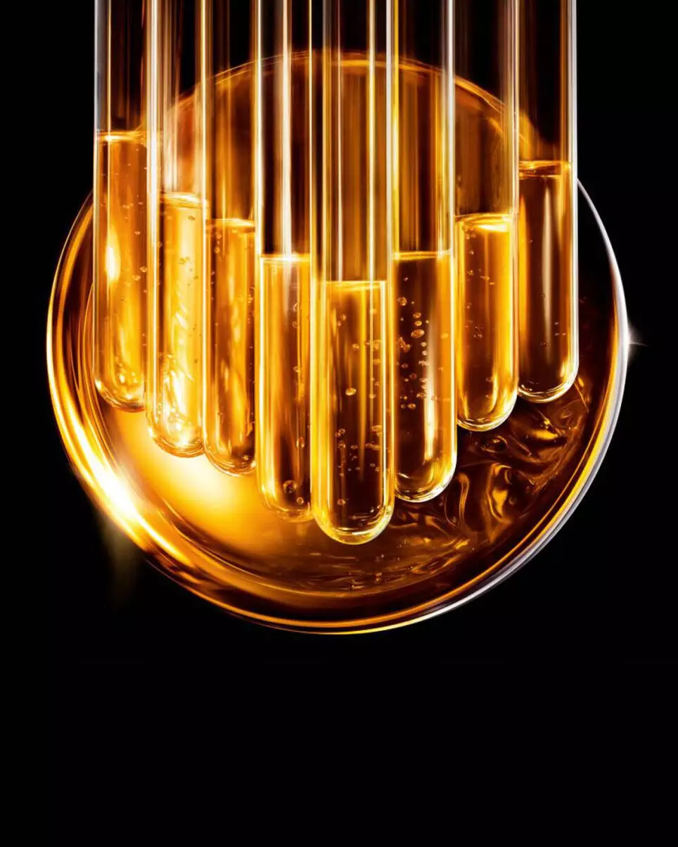 Golden laboratory glass tubes in liquid.