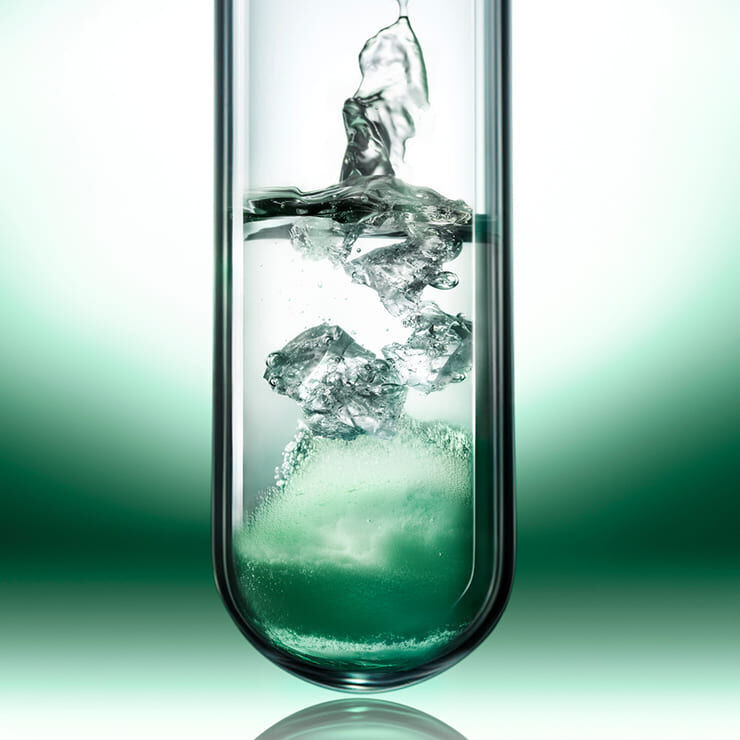 Laboratory test tube showing the infusion of green [EXO]Samphires for the Powercell Skinmunity formula.