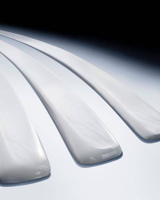 Three luxurious white cream swatches, showcasing a rich, smooth texture for Helena Rubinstein skincare.