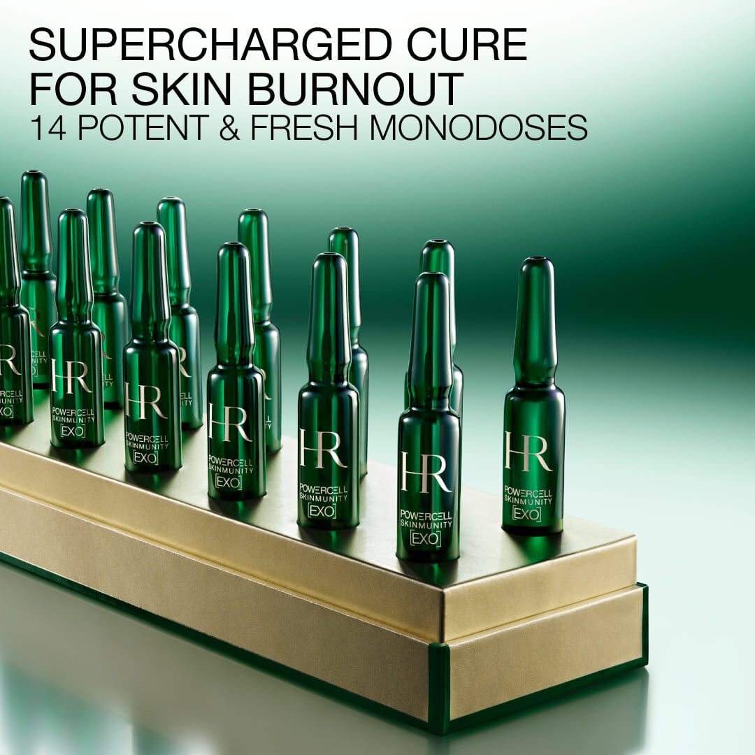 14 green Powercell Skinmunity EXO monodose ampoules on a luxury gold base.